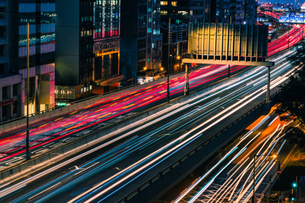 istock Traffic at bridge with sunset downtown in Hong Kong 1299416089
