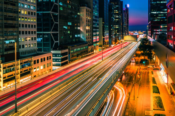 istock Traffic at bridge with sunset downtown in Hong Kong 1299416980