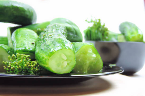 new crop cucumbers on a black plate