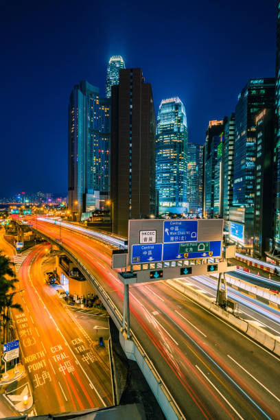 istock Traffic at bridge with sunset downtown in Hong Kong 1299417030