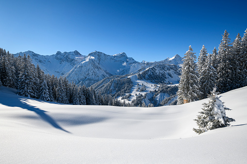 Snowy winter landscape and perfect conditions for skiing in ski resort. Photographed in Brandnertal, Vorarlberg, Austria.