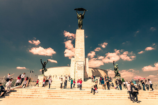 Tourists and city inhabitants, both love to climb to the  Gellért Hill on a summer day and take photos at the Liberty Statue or Freedom Statue in Budapest.
