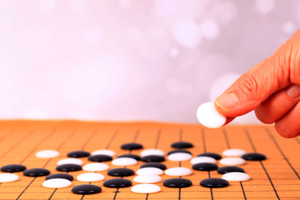 istock chinese game go,  Gobang and go game board 1299419817