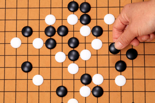 istock chinese game go,  Gobang and go game board 1299419832