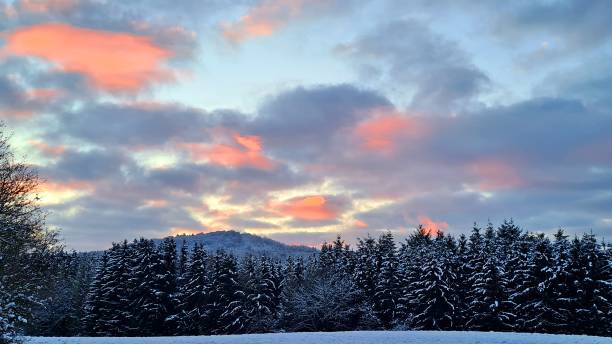 istock Sunset in the snowy Eifel mountains, Germany 1299420093