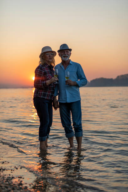 istock Beautiful sunset, let's make a toast with this wine on this beautiful day. 1299423024
