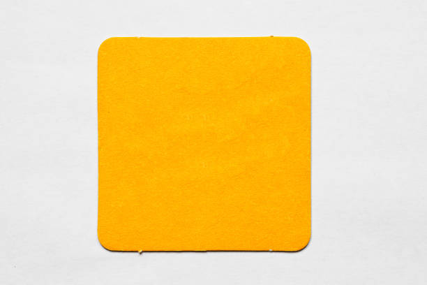 istock Old used coaster or bottle pad. For beer or other drinks, isolated. Add your own design, message or logo. 1299425526