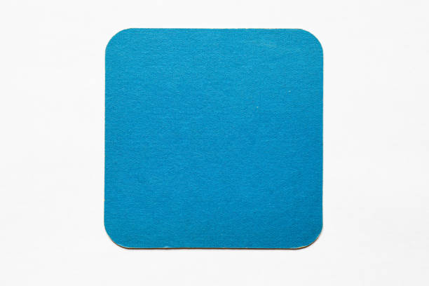 istock Old used coaster or bottle pad. For beer or other drinks, isolated. Add your own design, message or logo. 1299425850