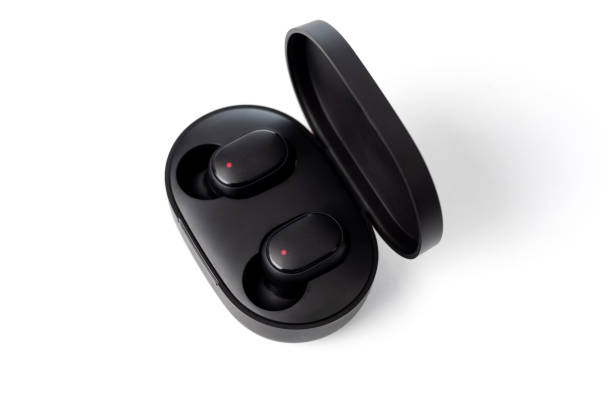 istock Bluetooth earbuds or earphones with box package isolated on white background. 1299425853