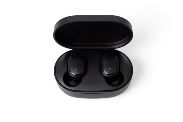 istock Bluetooth earbuds or earphones with box package isolated on white background. 1299425899