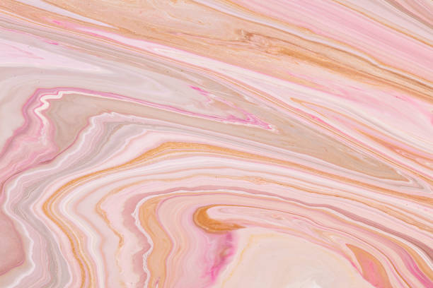 istock Fluid art texture. Abstract background with swirling paint effect. Liquid acrylic picture with flows and splashes. Mixed paints for background or poster. Pink, golden and white overflowing colors. 1299428091