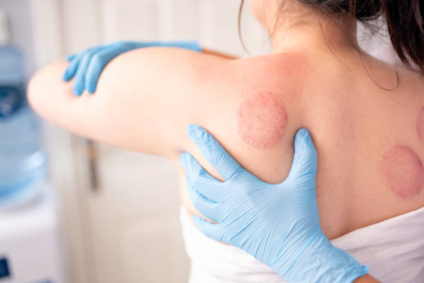 istock Female physiotherapist is examining to her patient. 1299429367