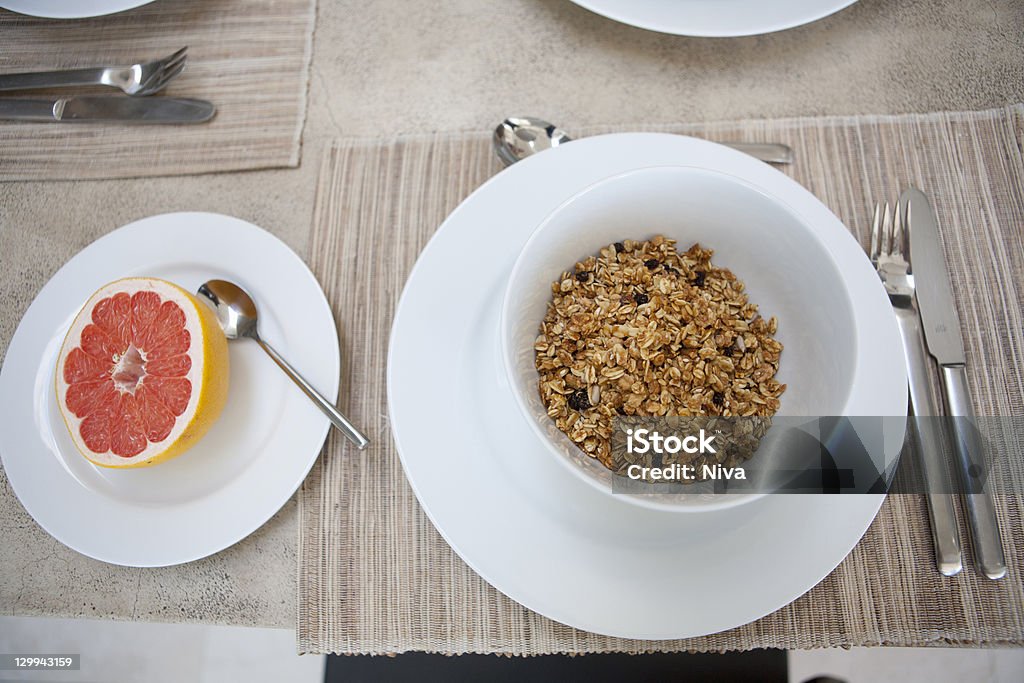 Cereal and grapefruit breakfast on table  Bowl Stock Photo