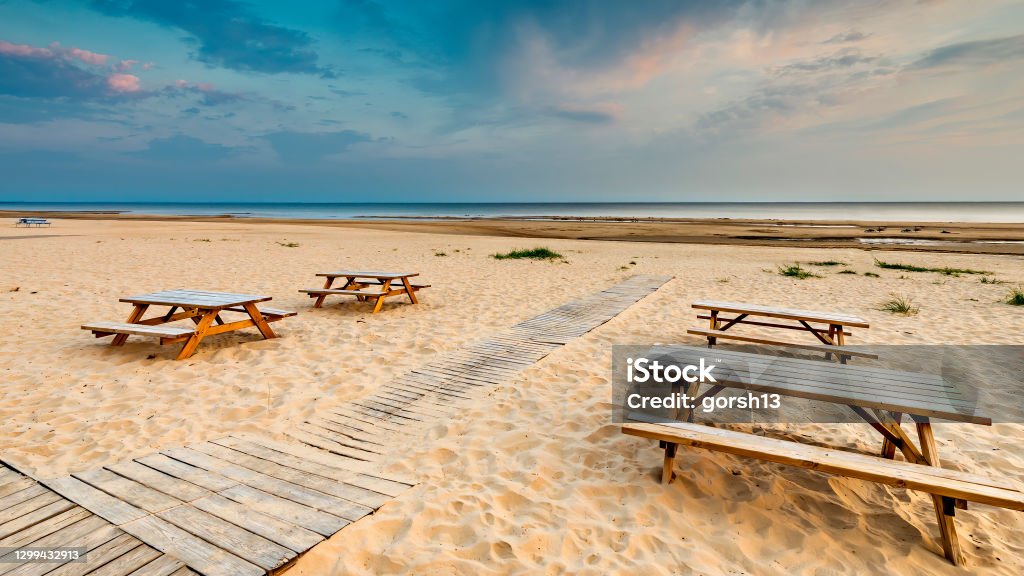 Wooden footpath leading to sandy beach of the Baltic Sea in Jurmala Jurmala is a famous tourist resort and recreational city in Baltic region, Latvia, Europe Baltic Countries Stock Photo