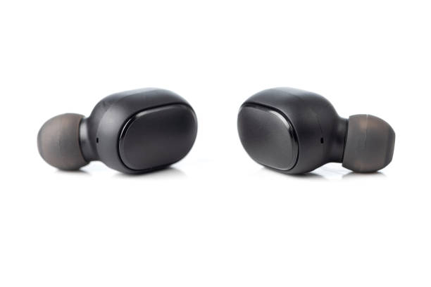 istock Bluetooth earbuds or earphones isolated on white background 1299434236