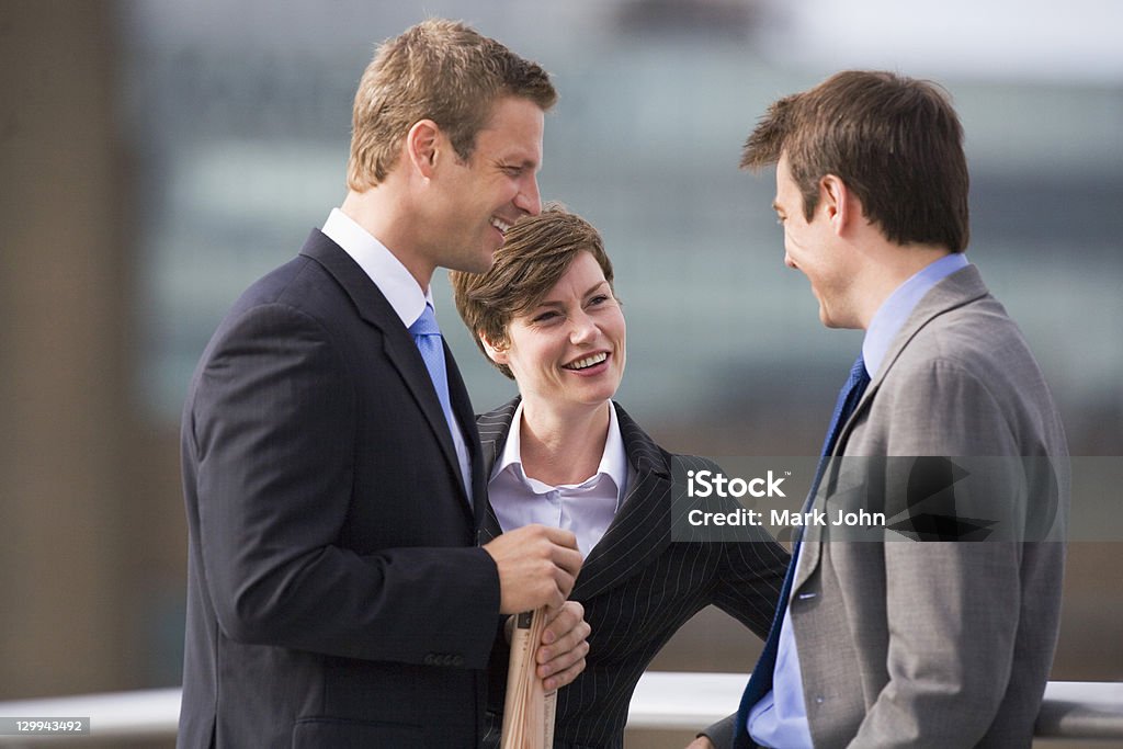 Business people talking outdoors  30-39 Years Stock Photo