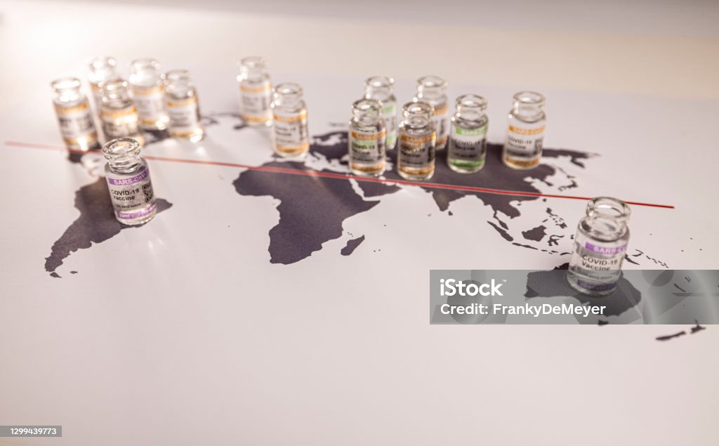 A world globe map with vials for the global SARS/COVID pandemic vaccine war, caused by vaccine nationalism and lack of vaccine solidarity, seen as a moral failure resulting in inequality Conceptual image of a world globe map for the global SARS/COVID pandemic, with vaccine hoarding, restricting equal access to vaccines across the world caused by vaccine nationalism and lack of vaccine solidarity. Seen as a moral failure resulting in inequality. Counteracted by the Covax programme and global vaccine alliance.World map fragment of Europe, Russia and Africa with COVID-19 (SARS-CoV-2) corona vaccine vials and injection syringe.

Notes:
- QR code on bottles was generated by my and contains generic text: "SARS-CoV-2 Vaccine""
- World map is in Public Domain: see: https://commons.wikimedia.org/wiki/File:BlankMap-World-noborders.png (author  E Pluribus Anthony has put it in public domain: see article in previous link) Poverty Stock Photo