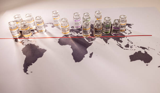 Conceptual image of a world globe map for the global SARS/COVID pandemic, with vaccine hoarding, restricting equal access to vaccines across the world caused by vaccine nationalism and lack of vaccine solidarity. Seen as a moral failure resulting in inequality. Counteracted by the Covax programme and global vaccine alliance.World map fragment of Europe, Russia and Africa with COVID-19 (SARS-CoV-2) corona vaccine vials and injection syringe.
Notes:
- QR code on bottles was generated by my and contains generic text: imagen conceptual de un mapa del globo terráqueo mundial para la pandemia mundial de sars/covid, con acaparamiento de vacunas, que restringe la igualdad de acceso a las vacunas en todo el mundo, visto como un fracaso moral que resulta en desigualdad,