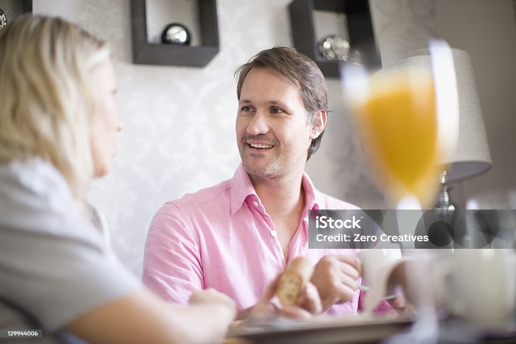 Couple drinking coffee at breakfast  30-39 Years Stock Photo