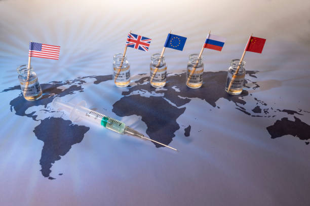 Conceptual image of a world globe map for the global SARS/COVID pandemic, with vaccine hoarding, restricting equal access to vaccines across the world caused by vaccine nationalism and lack of vaccine solidarity. Seen as a moral failure resulting in inequality. Counteracted by the Covax programme and global vaccine alliance.World map fragment of Europe, Russia and Africa with COVID-19 (SARS-CoV-2) corona vaccine vials and injection syringe.
Notes:
- QR code on bottles was generated by my and contains generic text: banderas de estados unidos, reino unido, ue, rusia y china en el mapa mundial con viales para la guerra mundial de vacunas antipandémicas sars/covid, con acaparamiento de vacunas, restricción de la igualdad de acceso a las vacunas en todo el mundo, causa