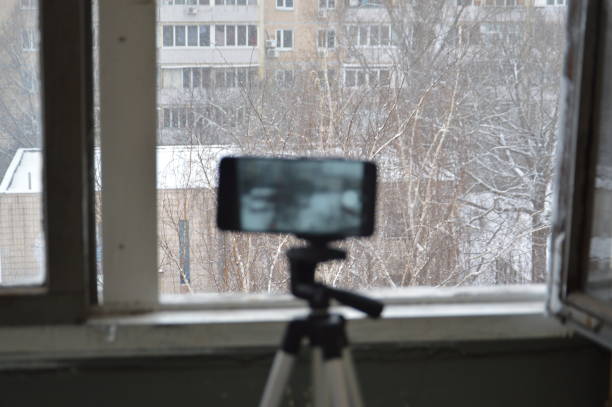 istock Taking photos and videos on a smartphone with a the tripod 1299440811