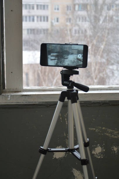 istock Taking photos and videos on a smartphone with a the tripod 1299440826
