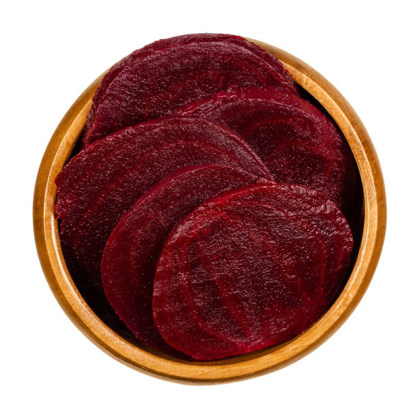 istock Cooked beetroot slices, boiled sliced red beets in a wooden bowl 1299440980