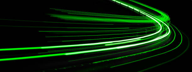 istock green car lights at night. long exposure 1299441812