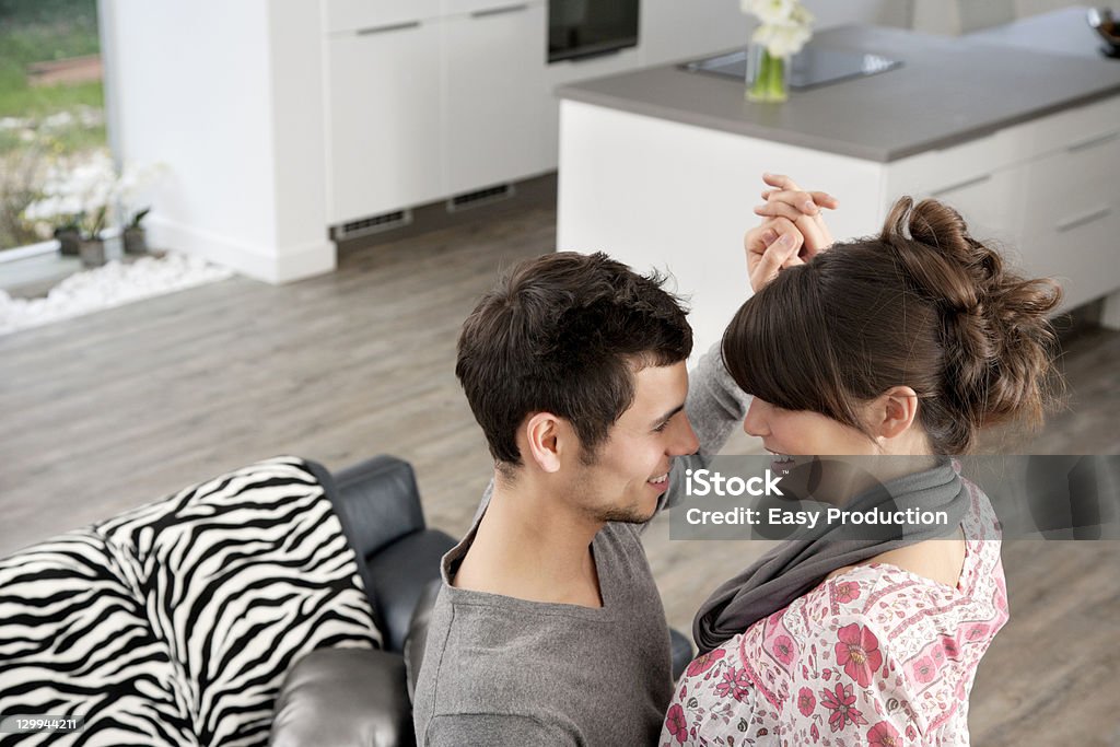 Couple dancing in living room  20-24 Years Stock Photo