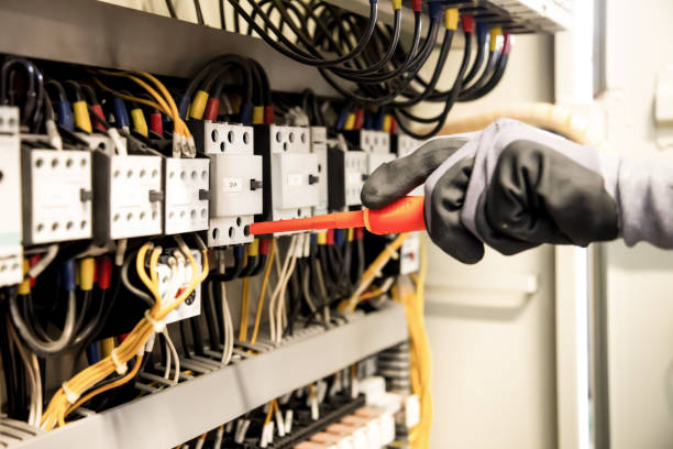 istock Electricians work to connect electric wires in the system. 1299443122