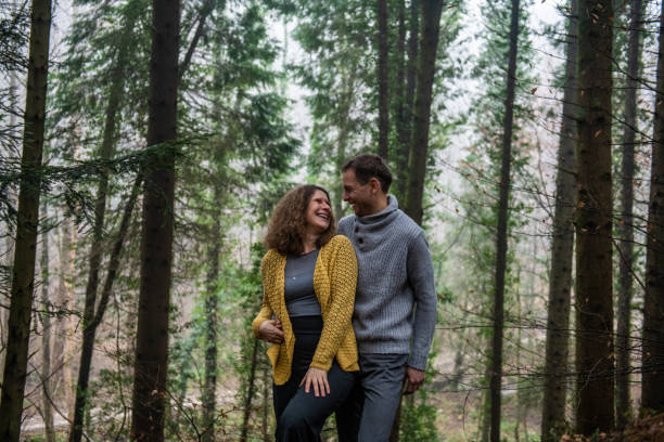 istock Couple in Love posing in the Spruce Forest 1299443460