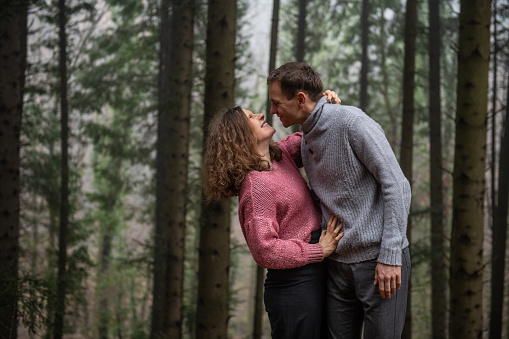 Couple in Love posing in the Spruce Forest