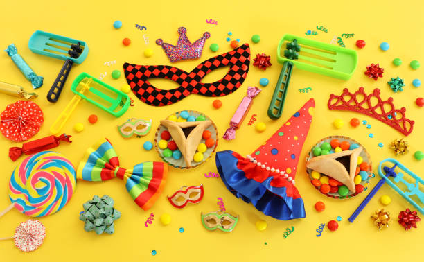 Purim celebration concept (jewish carnival holiday) over yellow background. Top view, flat lay Purim celebration concept (jewish carnival holiday) over yellow background. Top view, flat lay religious celebration audio stock pictures, royalty-free photos & images