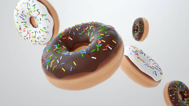 istock Flying doughnuts scene - mix of multi colored sweet donuts with sprinkle on white background 1299445867