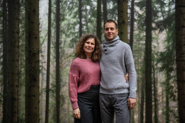 istock Adult Couple posing in the Spruce Forest 1299446765