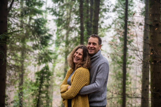 istock Couple in Love posing in the Spruce Forest 1299447013