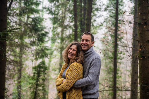 Couple in Love posing in the Spruce Forest