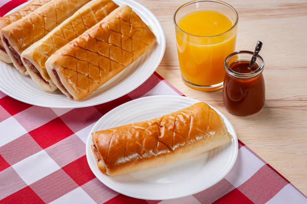 Baked Brazilian appetizer stuffed with ham and cheese.