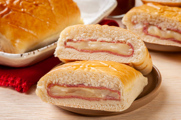 istock Baked Brazilian appetizer stuffed with ham and cheese. 1299452253