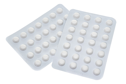 Pills in blister packs - white background