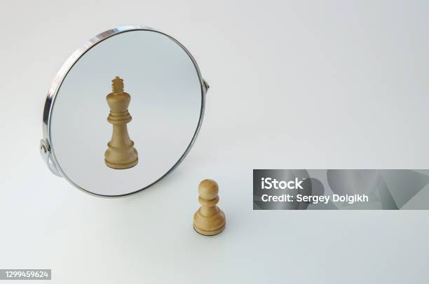 Chess Pawn Imagining Itself As A King Pawn In A Mirror Being A King Stock Photo - Download Image Now