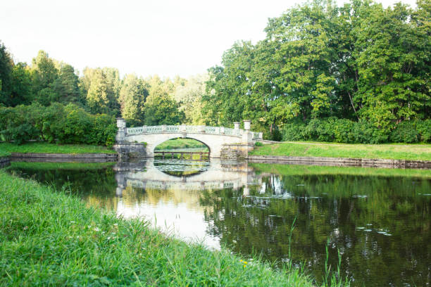 istock old vintage bridge on river in green park, landscape historical 1299461059