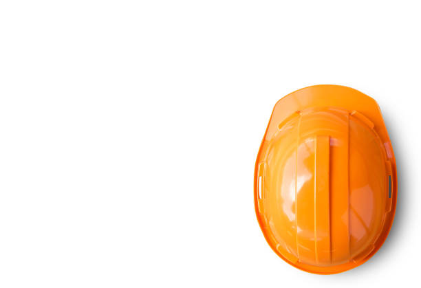 Orange safety engineer helmet isolated on white background. top view with copy space for design.