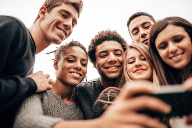 istock friends take a selfie at the park 1299462242