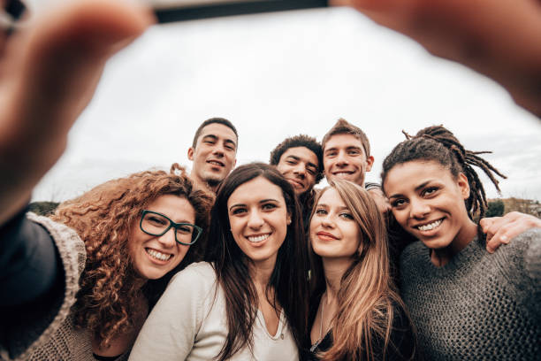 istock friends take a selfie at the park 1299462306