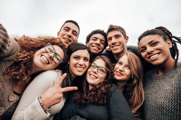 istock friends take a selfie at the park 1299462355