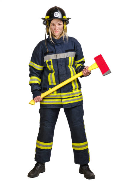 istock Young woman in uniform of firefighter with axe in hands 1299462457