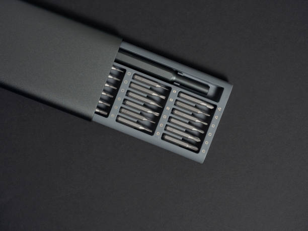 istock A set of screwdrivers with bits in a case on a dark background. Close up, flat lay, tools for work 1299462467