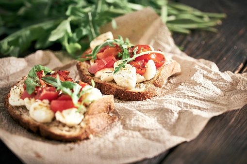Mozzarella cheese with crunchy baguette and tomatoes
