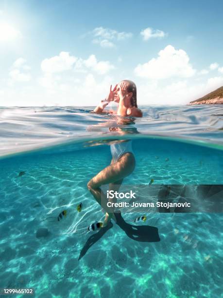 Swimming With Fish In The Sea Stock Photo - Download Image Now - Beach, Women, Swimming